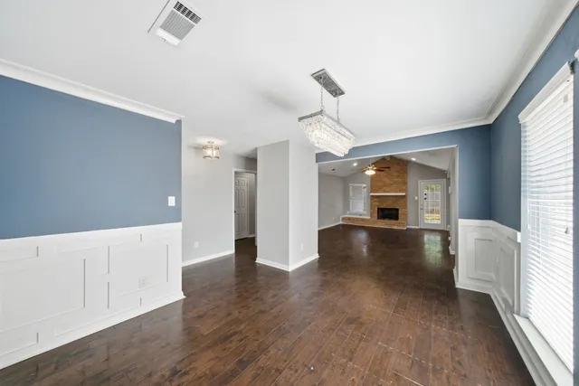 a view of livingroom with hardwood floor and a ceiling fan
