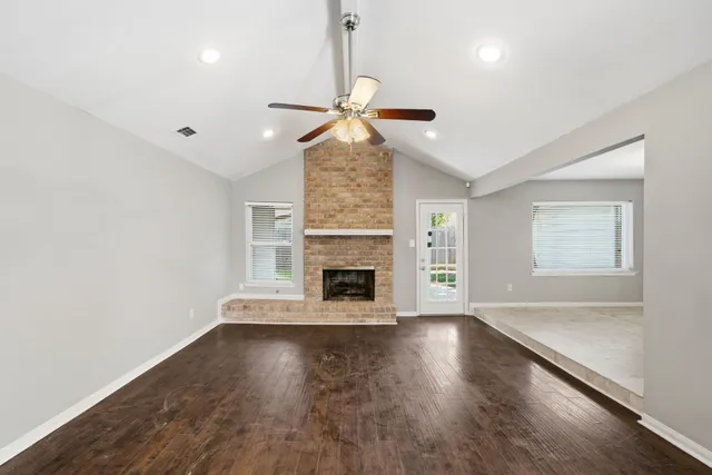 a view of a room window and wooden floor