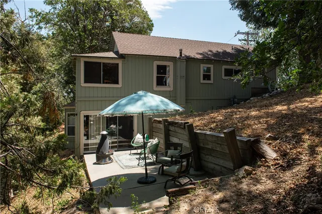 a view of a patio with table and chairs and potted plants