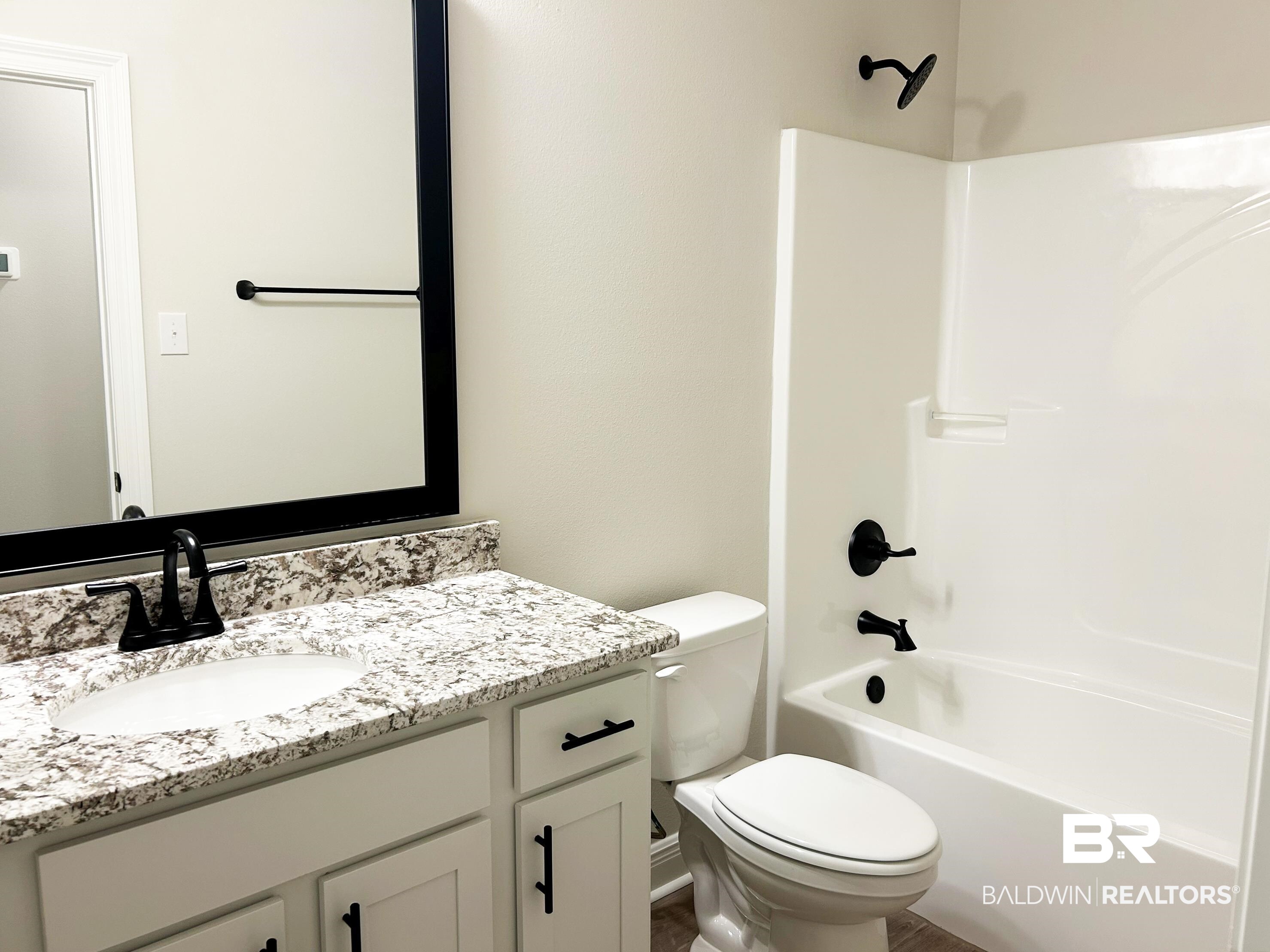 873 Sumter Loop Foley, AL 36535 - Photo 12 of 26 Full bathroom featuring shower / bath combination and vanity