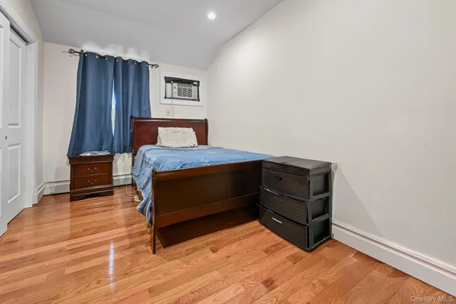 a bedroom with a bed and a cabinets
