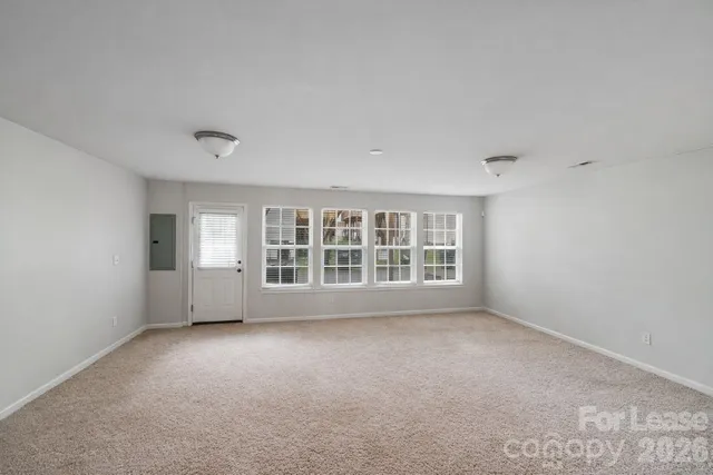 a view of empty room with windows