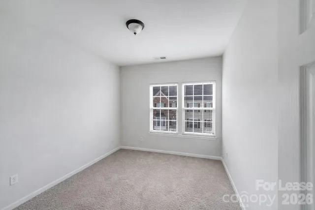 a view of empty room with windows