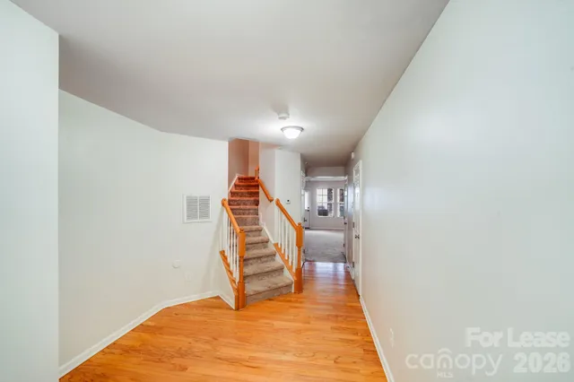 a view of entryway with wooden floor