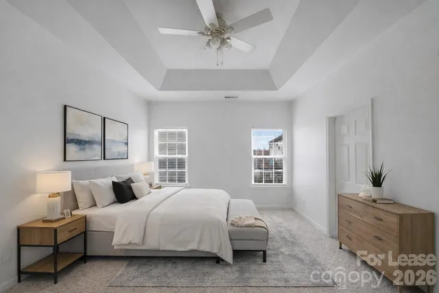 a bedroom with bed and window