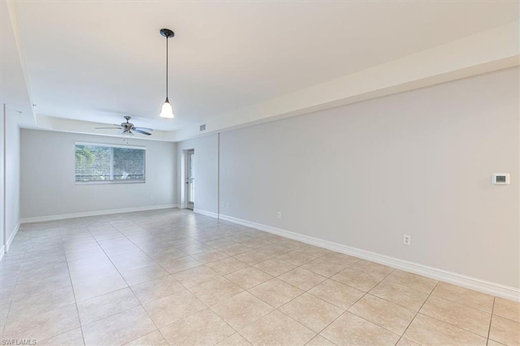 1100 Pine Ridge Road Naples, FL 34108 - Photo 12 of 21 a view of an empty room and a window