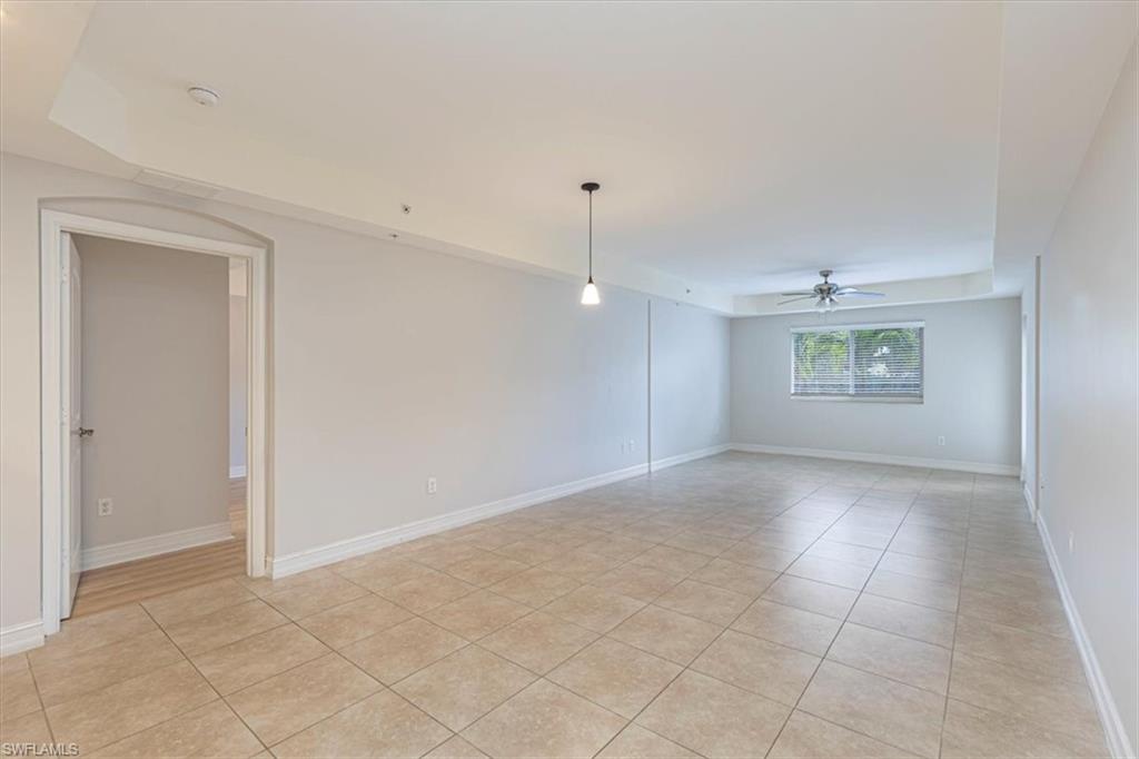 1100 Pine Ridge Road Naples, FL 34108 - Photo 14 of 21 an empty room with a empty space and windows