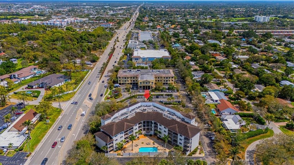 1100 Pine Ridge Road Naples, FL 34108 - Photo 2 of 21 an aerial view of residential houses with outdoor space