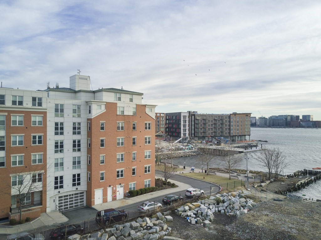 99 Sumner Street, Unit 306 Boston, MA 02128 - Photo 11 of 11 a view of a city with tall buildings