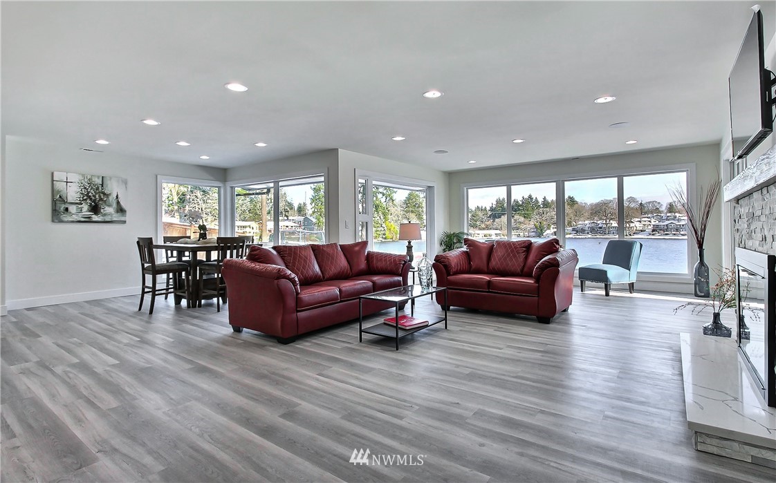 8925 Lake Steilacoom Point Road Southwest Lakewood, WA 98498 - Photo 11 of 31 a living room with furniture and a wooden floor