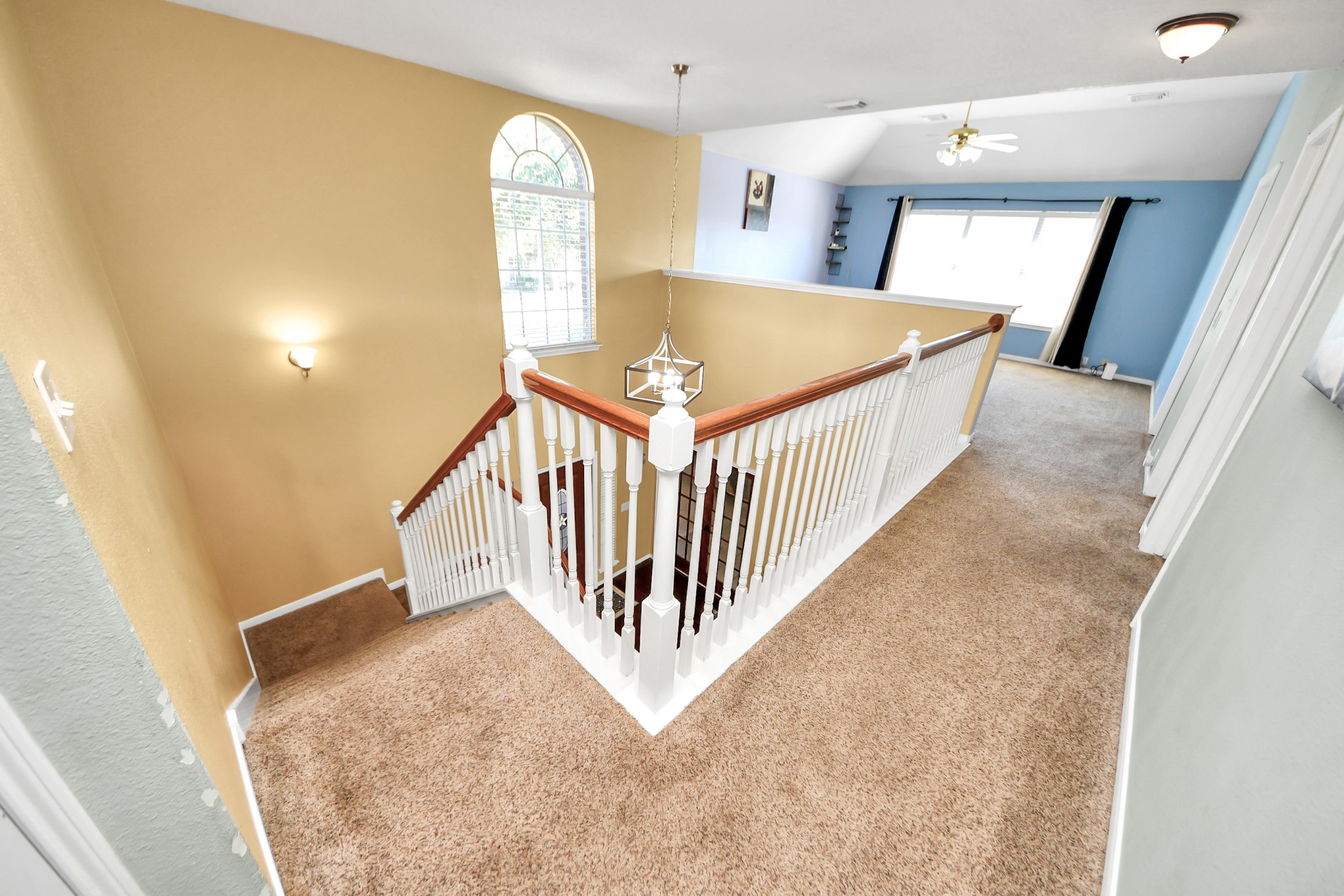 13635 Treebank Lane Houston, TX 77070 - Photo 19 of 37 a view of staircase and bathroom with wooden floor