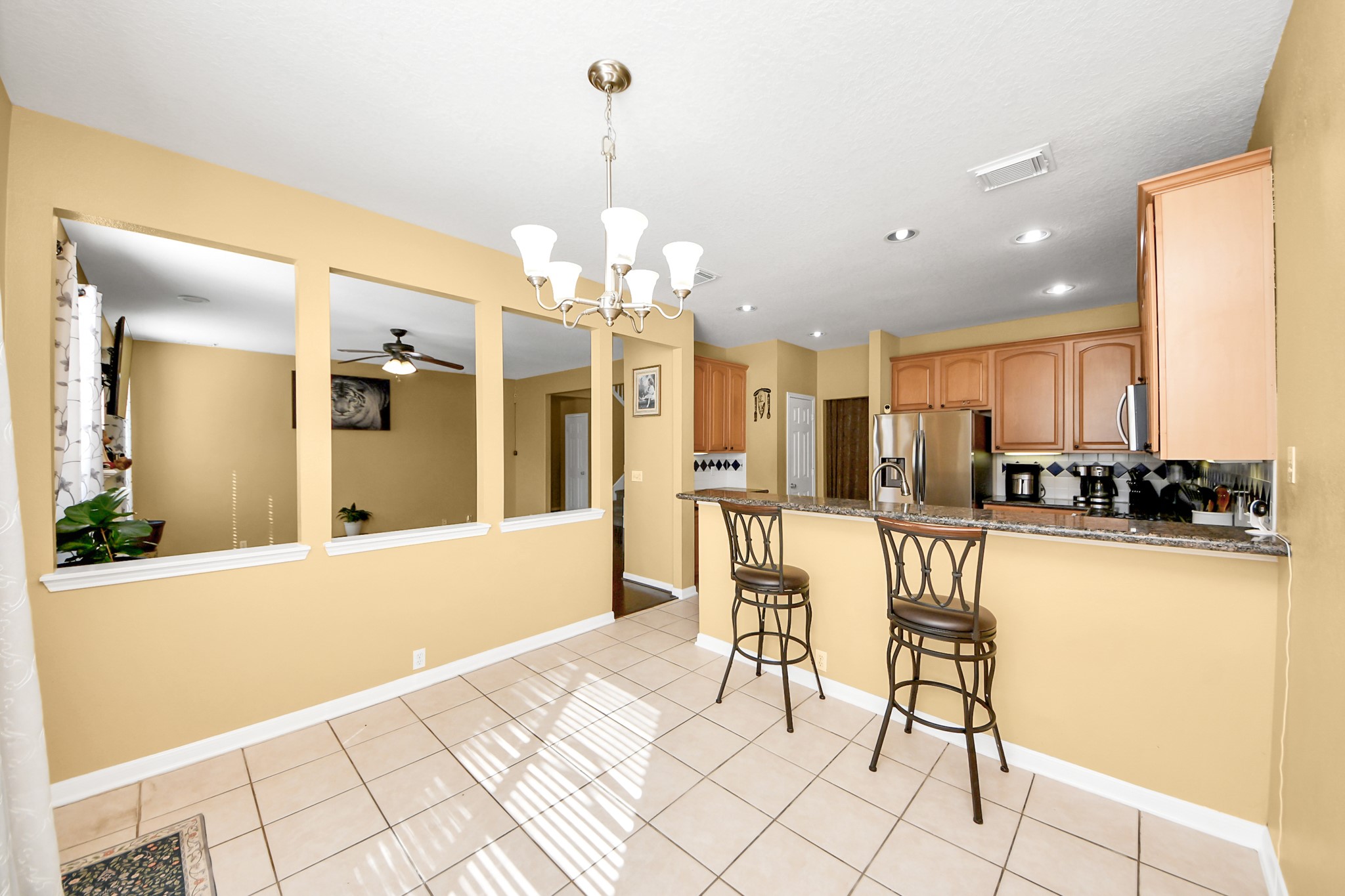 13635 Treebank Lane Houston, TX 77070 - Photo 7 of 37 a view of a dining room kitchen and a window
