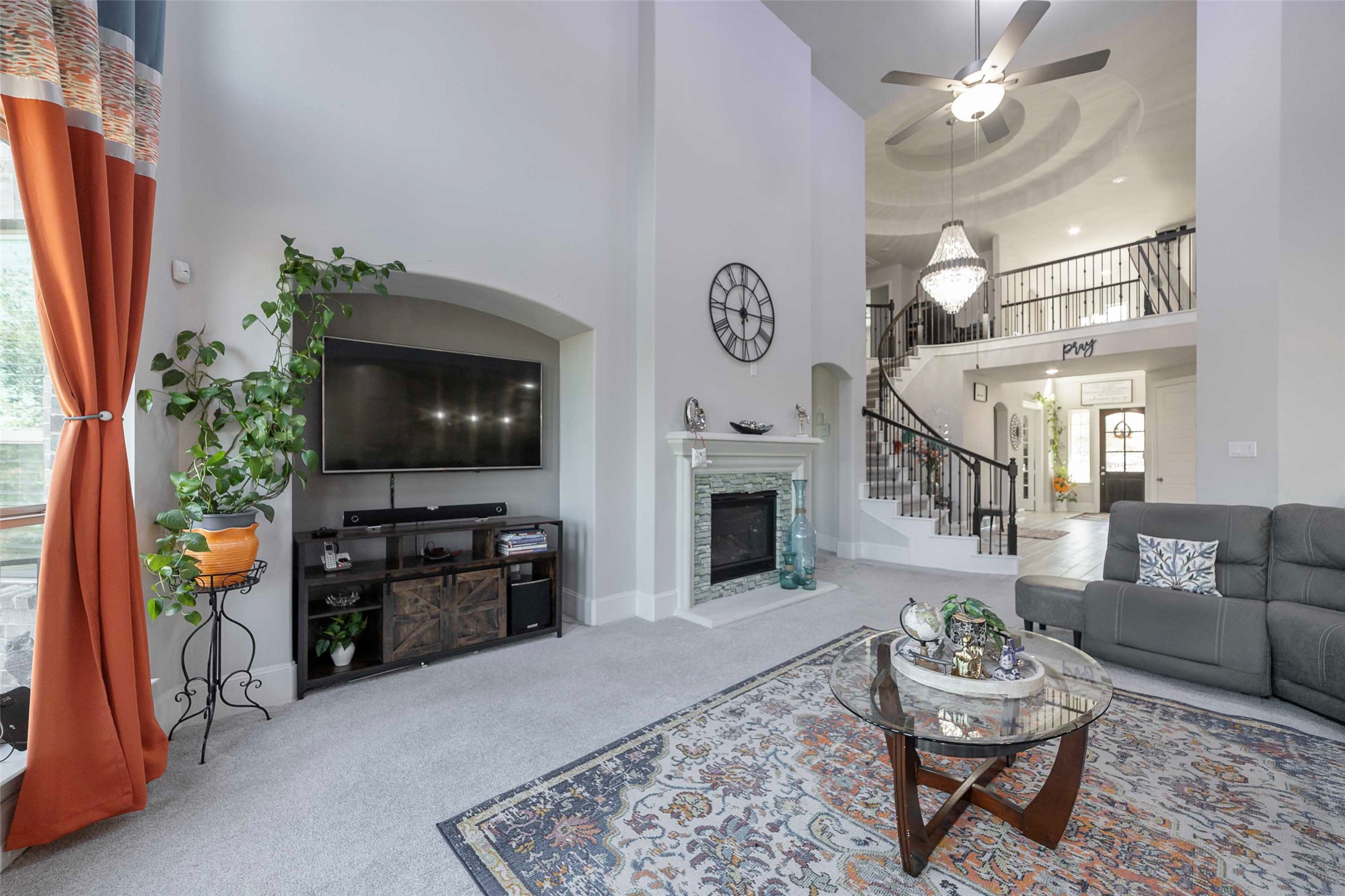 17821 Limestone Spring Lane Austin, TX 78738 - Photo 12 of 40 a living room with furniture a flat screen tv and a fireplace