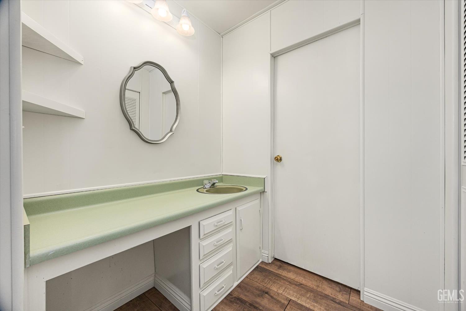 Undisclosed Address Bakersfield, CA 93306 - Photo 20 of 30 a bathroom with a granite countertop sink and a mirror