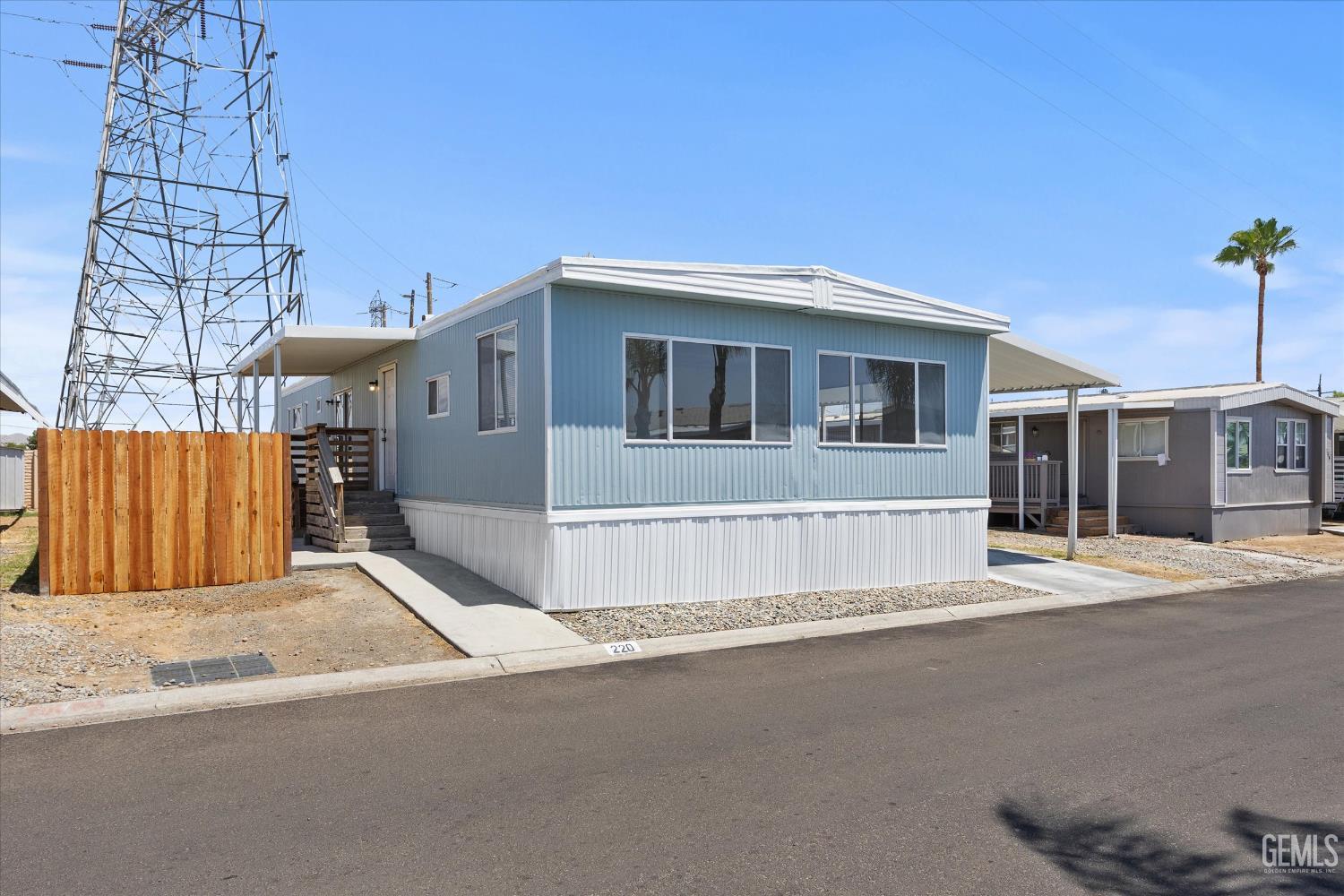 Undisclosed Address Bakersfield, CA 93306 - Photo 2 of 30 a front view of a house with a basket ball court