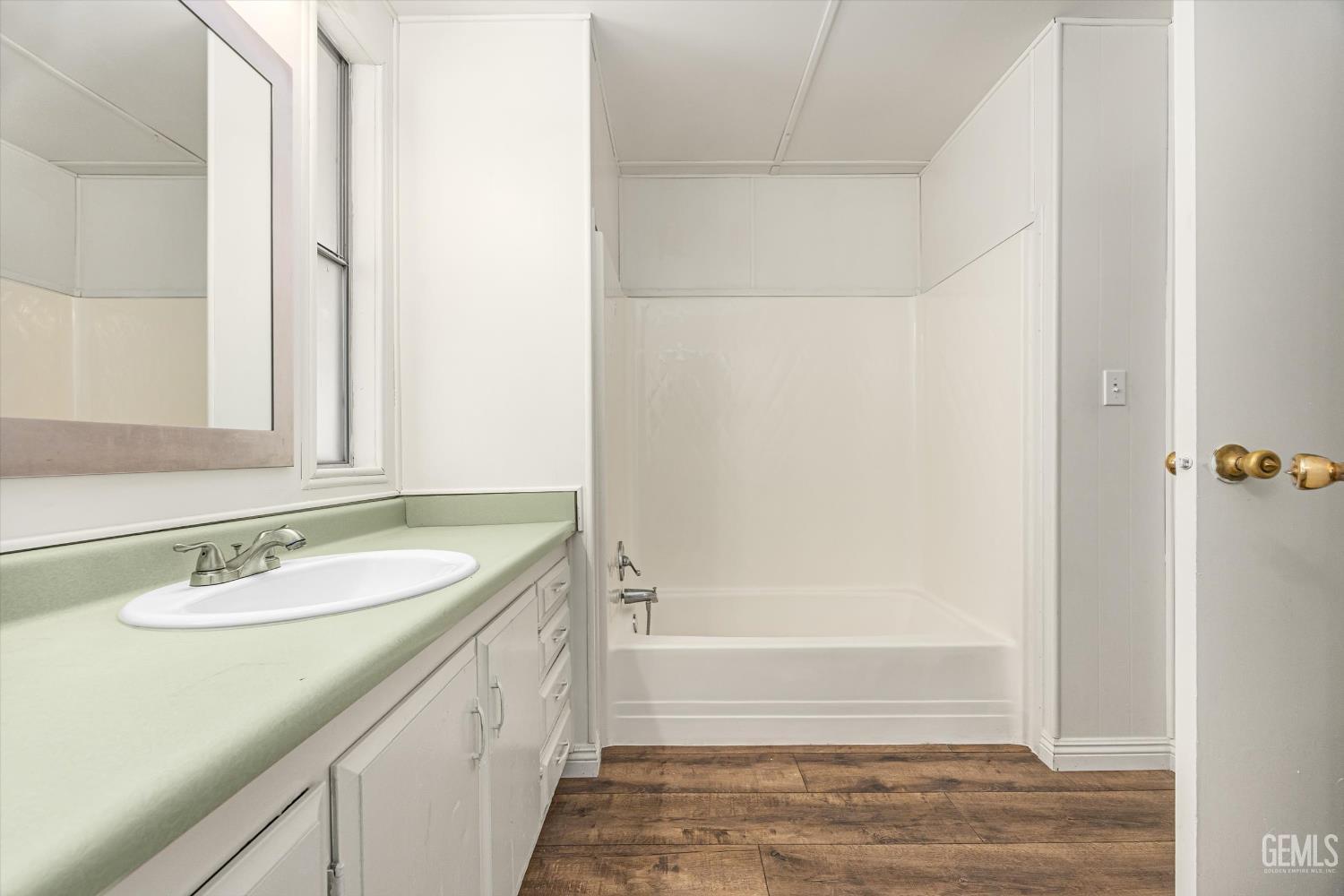 Undisclosed Address Bakersfield, CA 93306 - Photo 21 of 30 a bathroom with a granite countertop sink and a mirror