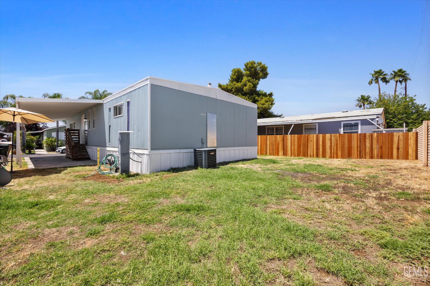 Undisclosed Address Bakersfield, CA 93306 - Photo 28 of 30 a house with garden in front of it