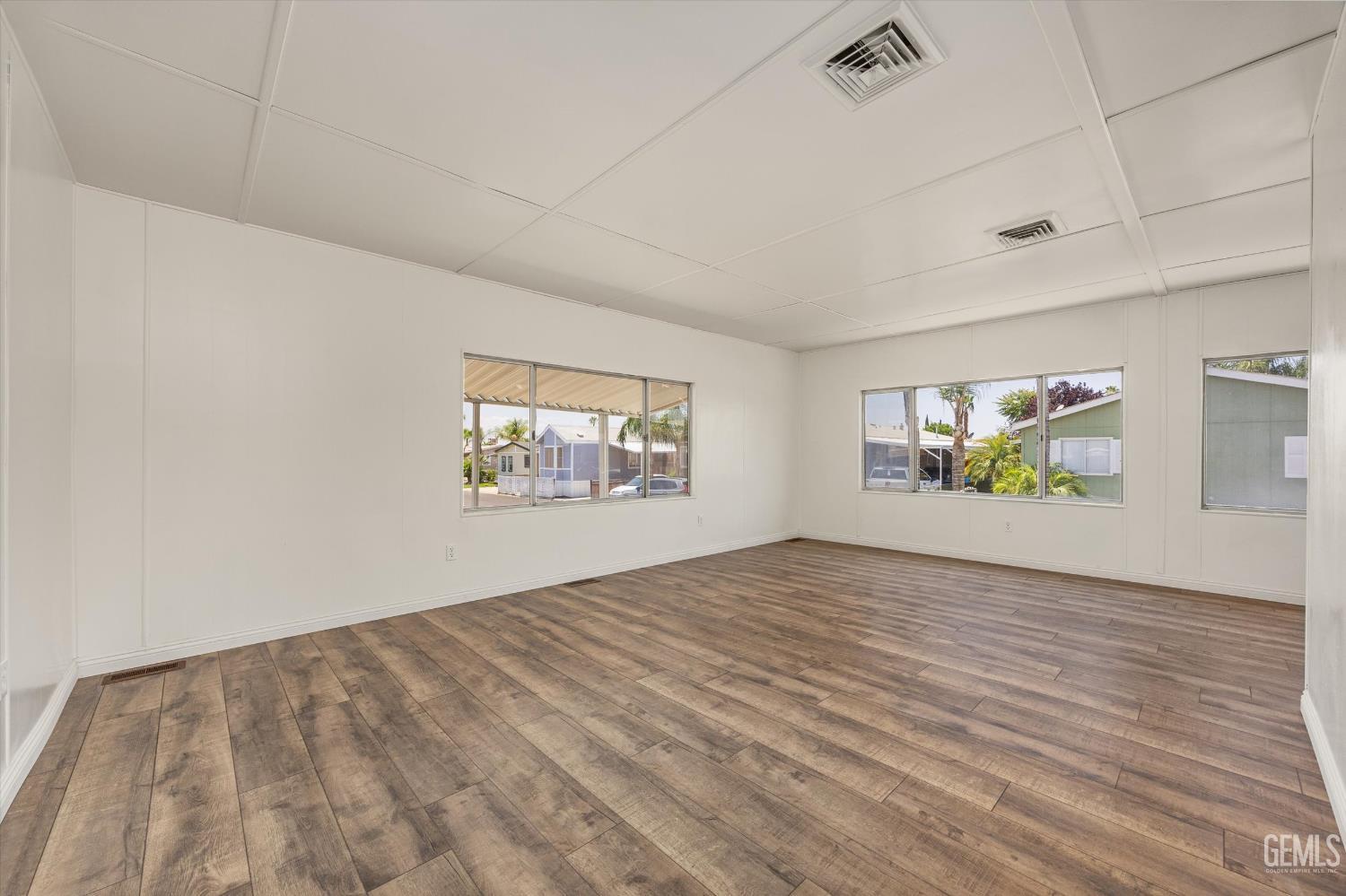 Undisclosed Address Bakersfield, CA 93306 - Photo 5 of 30 a view of empty room with wooden floor