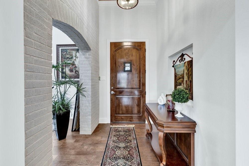 580 County Road 3422 Wills Point, TX 75169 - Photo 11 of 38 a hallway with front door wooden floor and table