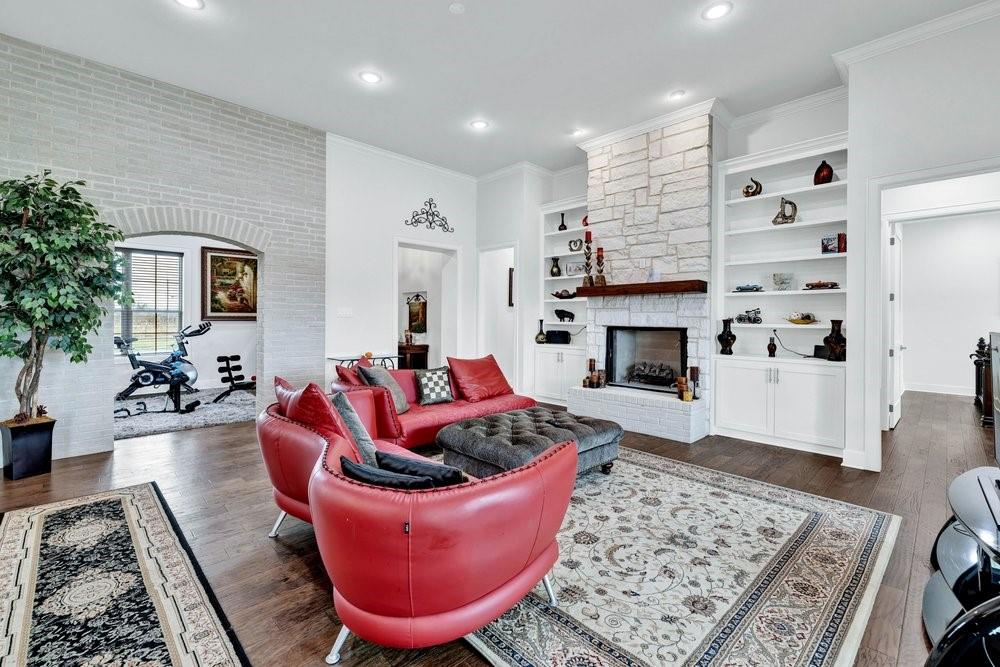 580 County Road 3422 Wills Point, TX 75169 - Photo 13 of 38 a living room with furniture and a fireplace