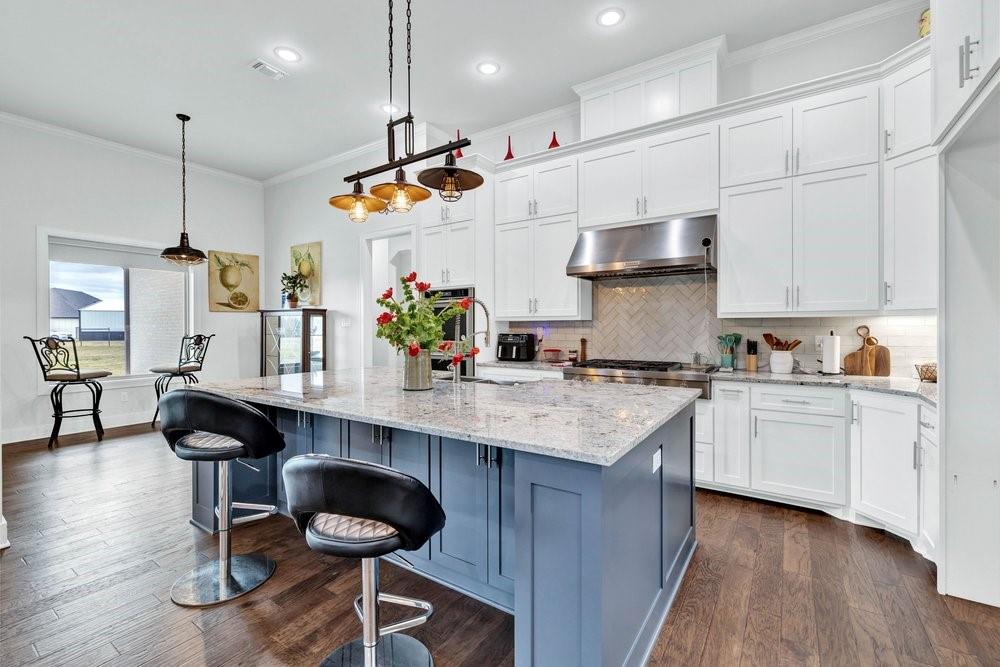 580 County Road 3422 Wills Point, TX 75169 - Photo 15 of 38 a kitchen with stainless steel appliances granite countertop a sink a stove and a refrigerator