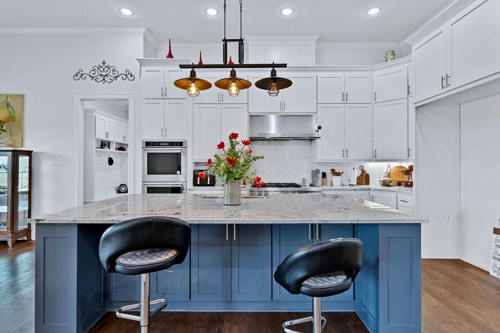 580 County Road 3422 Wills Point, TX 75169 - Photo 16 of 38 a kitchen with stainless steel appliances granite countertop a sink a refrigerator and a stove