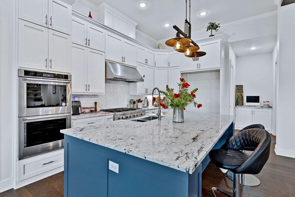 580 County Road 3422 Wills Point, TX 75169 - Photo 17 of 38 a kitchen with stainless steel appliances granite countertop a sink a stove and a refrigerator