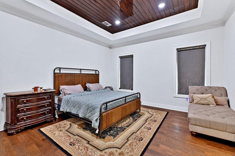 580 County Road 3422 Wills Point, TX 75169 - Photo 22 of 38 a bedroom with a bed and wooden floor