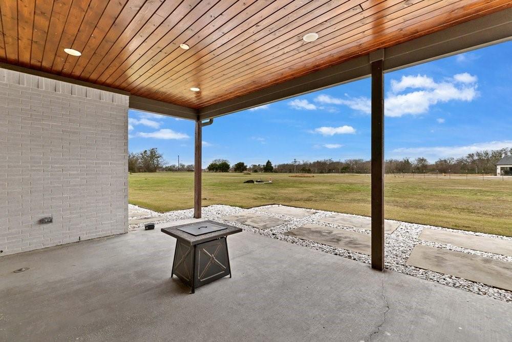 580 County Road 3422 Wills Point, TX 75169 - Photo 37 of 38 a view of a terrace with a ocean view