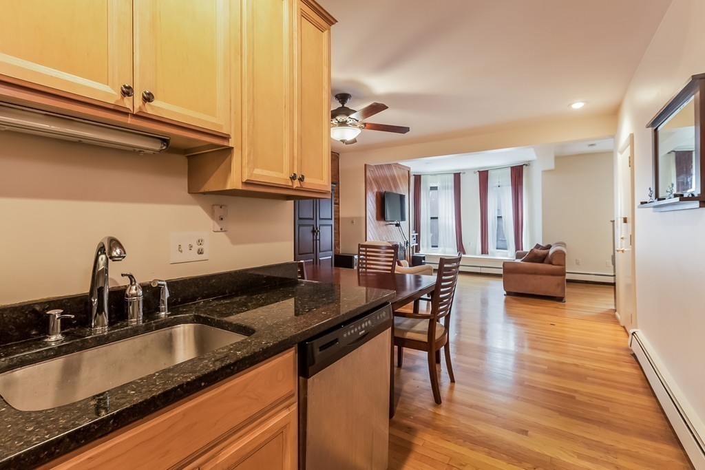 36 Symphony Road, Unit 3B Boston, MA 02115 - Photo 12 of 21 a kitchen with granite countertop a sink and cabinets