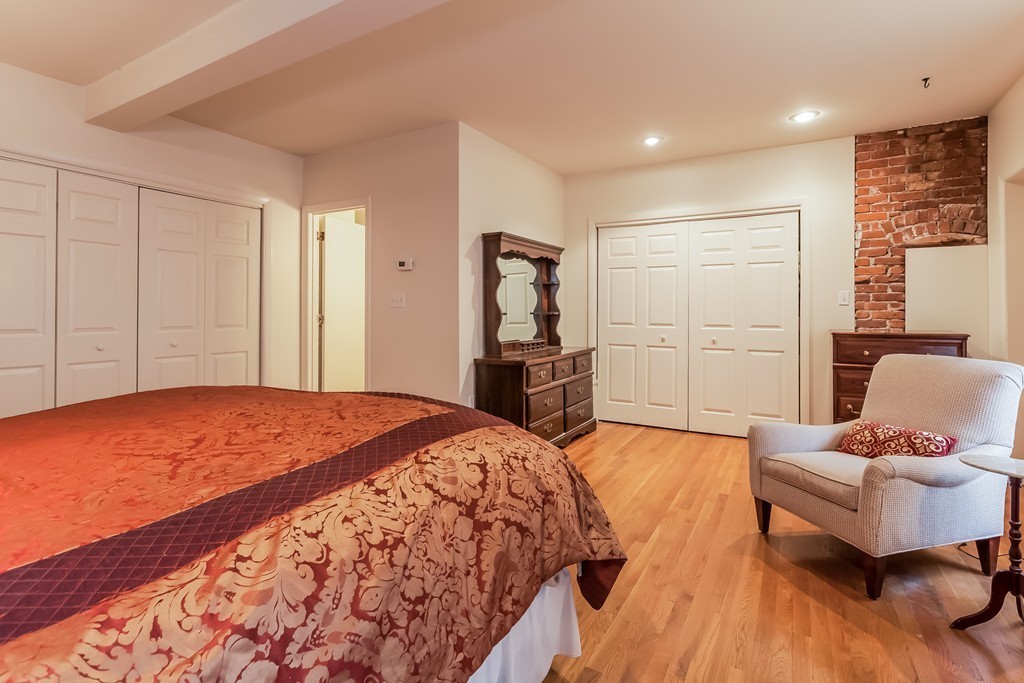 36 Symphony Road, Unit 3B Boston, MA 02115 - Photo 16 of 21 a spacious bedroom with a bed and furniture
