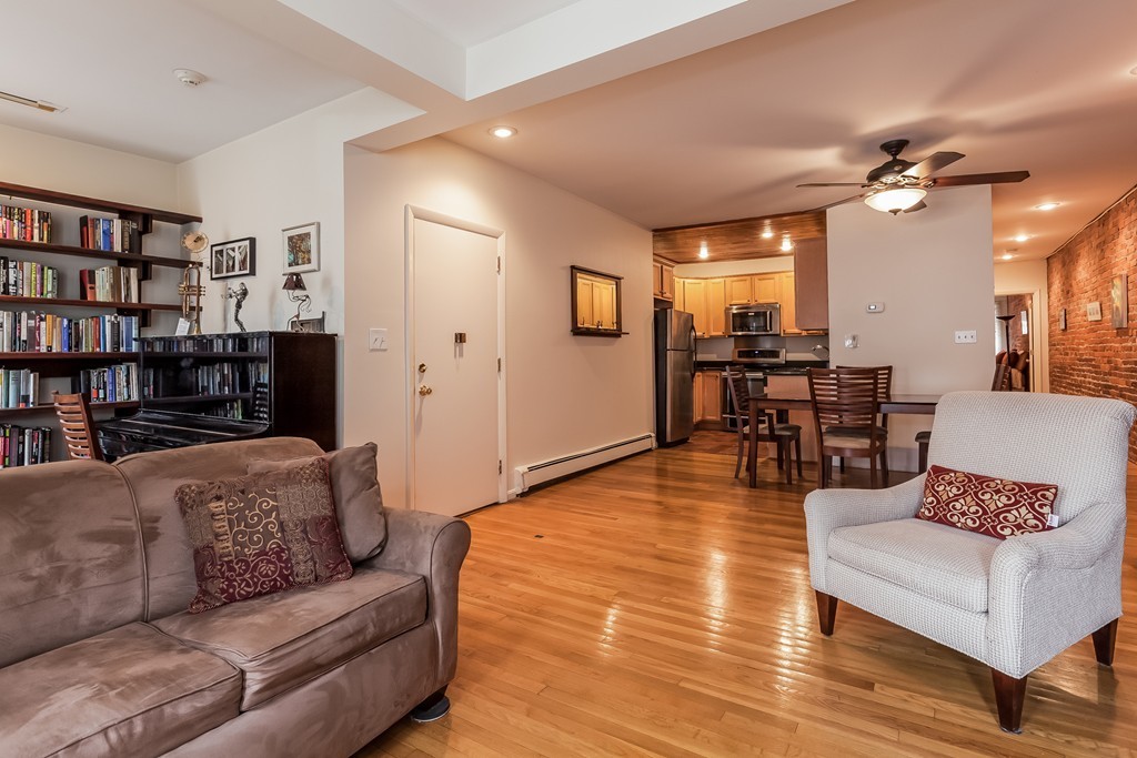 36 Symphony Road, Unit 3B Boston, MA 02115 - Photo 3 of 21 a living room with furniture and a wooden floor