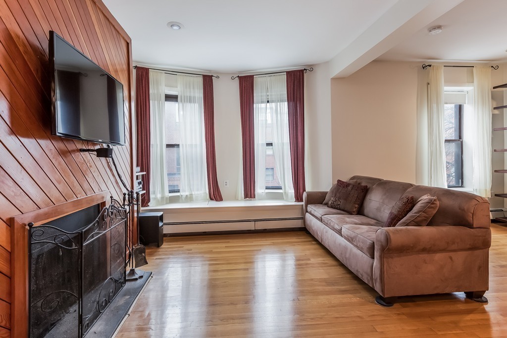 36 Symphony Road, Unit 3B Boston, MA 02115 - Photo 4 of 21 a living room with furniture and a fireplace