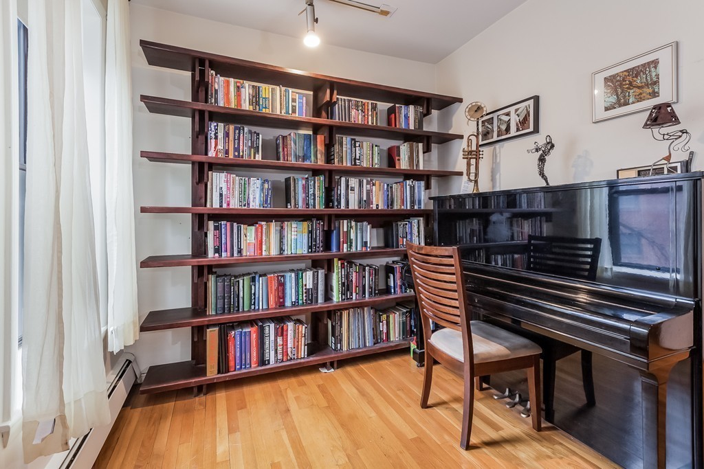36 Symphony Road, Unit 3B Boston, MA 02115 - Photo 5 of 21 a view of a livingroom with furniture and a bookshelf