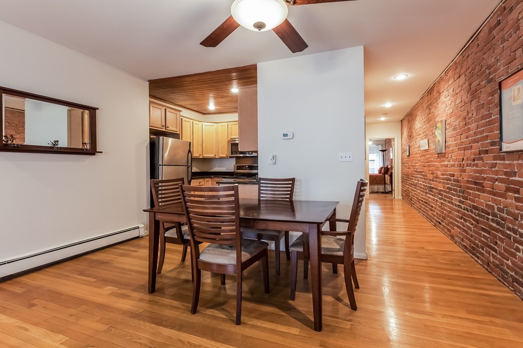 36 Symphony Road, Unit 3B Boston, MA 02115 - Photo 6 of 21 a dining room with furniture and wooden floor