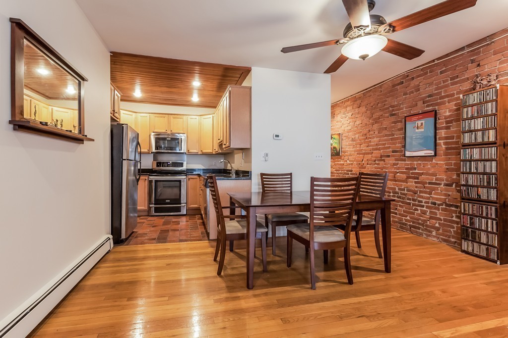 36 Symphony Road, Unit 3B Boston, MA 02115 - Photo 7 of 21 a view of a dining room with furniture and wooden floor