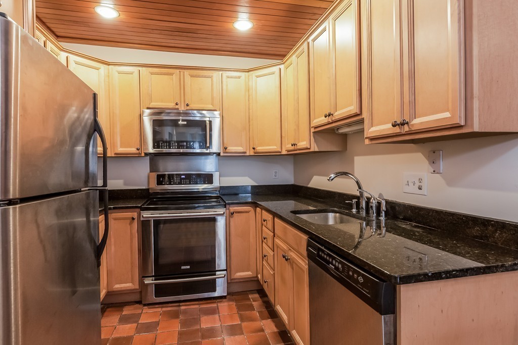36 Symphony Road, Unit 3B Boston, MA 02115 - Photo 9 of 21 a kitchen with a stove microwave and sink