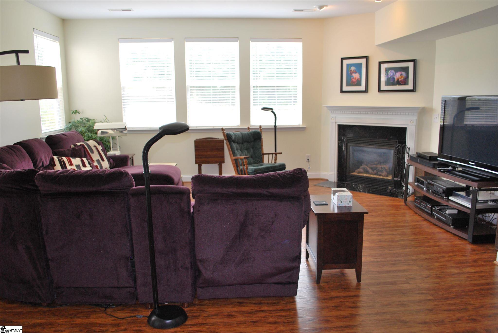 130 Scottish Avenue Simpsonville, SC 29680 - Photo 5 of 20 Family room with a wall of windows and gas fireplace