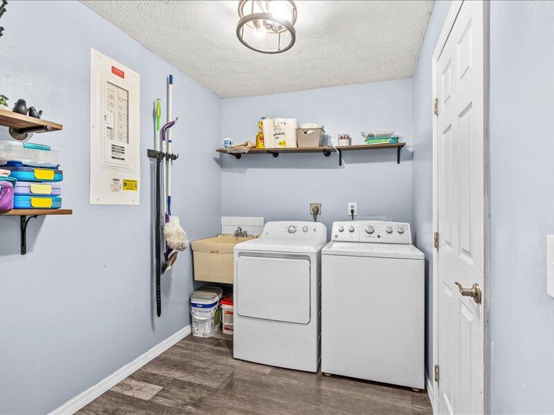 1297 Southeast Floresta Drive Port St. Lucie, FL 34983 - Photo 23 of 42 a utility room with dryer and washer