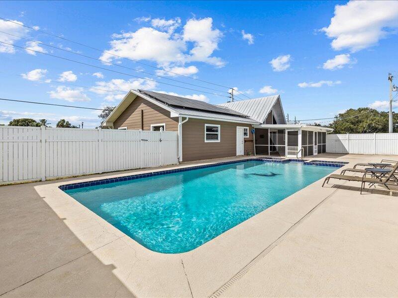 1297 Southeast Floresta Drive Port St. Lucie, FL 34983 - Photo 31 of 42 a view of a house with a backyard