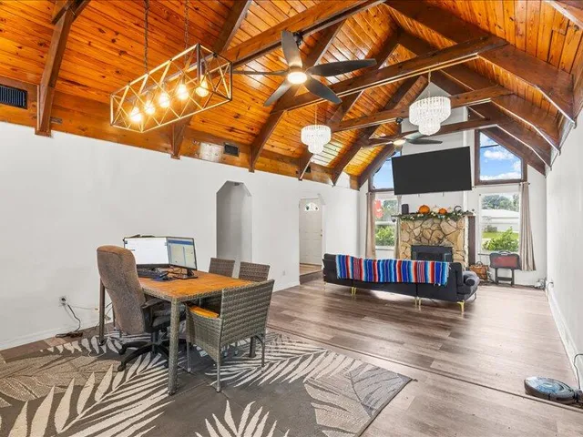 a kitchen with stainless steel appliances granite countertop a refrigerator and a stove