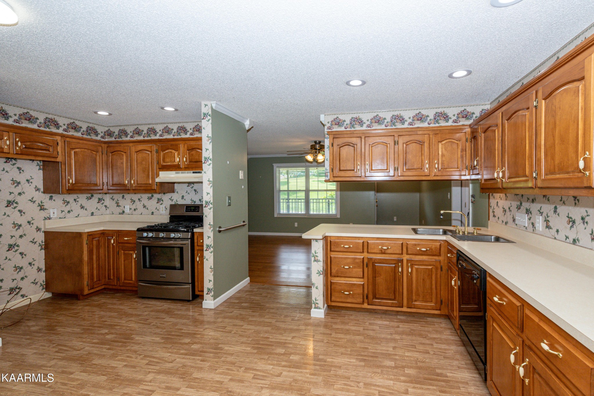 1613 Sevierville Road Maryville, TN 37804 - Photo 20 of 50 a kitchen with stainless steel appliances granite countertop a sink stove and cabinets