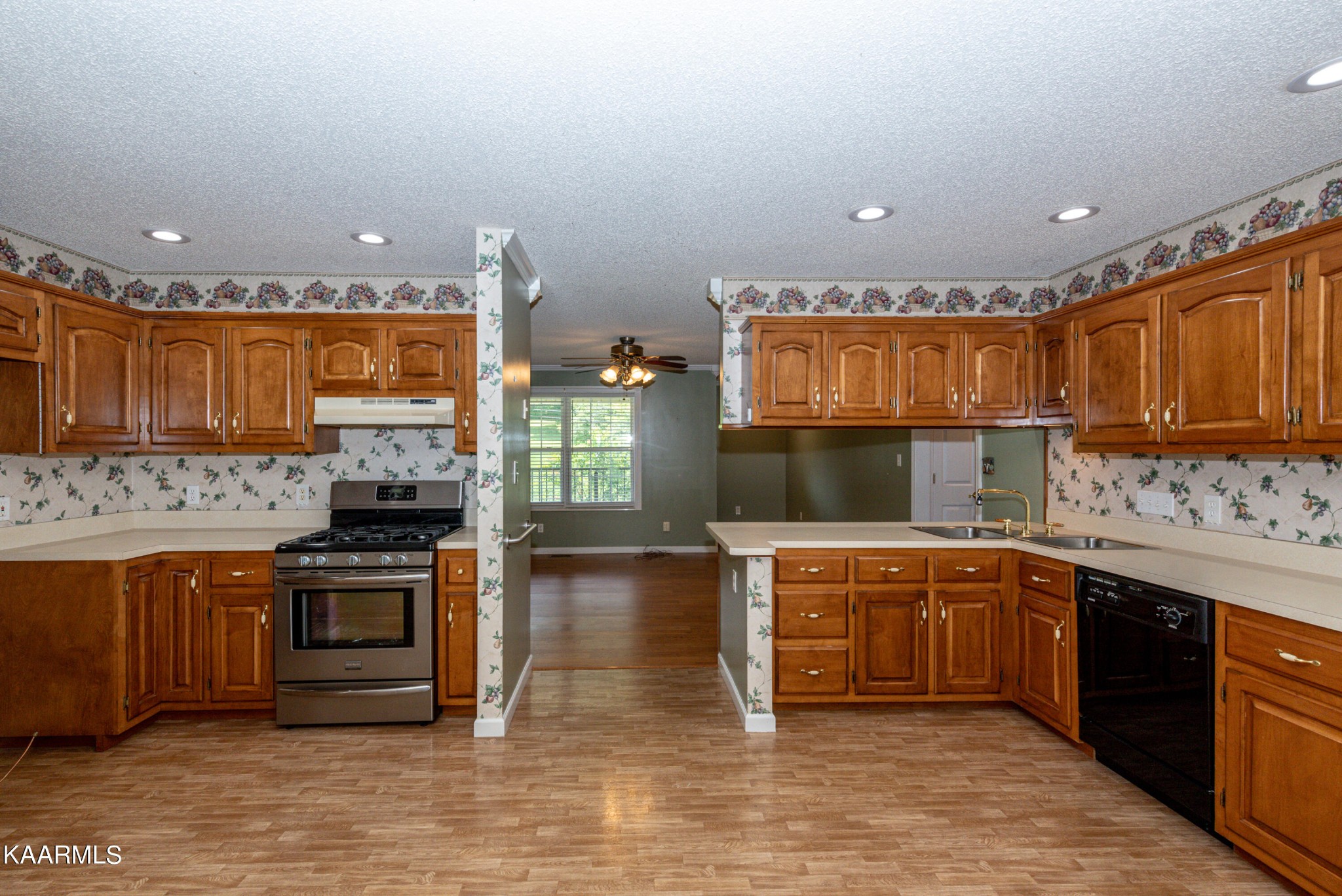 1613 Sevierville Road Maryville, TN 37804 - Photo 21 of 50 a kitchen with stainless steel appliances granite countertop a stove a sink and a microwave