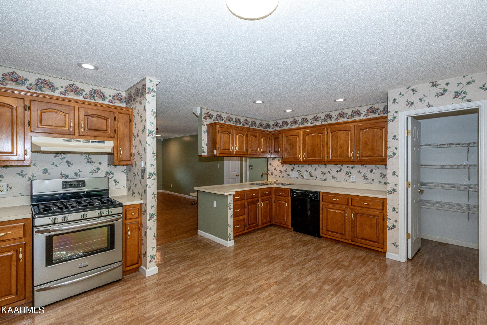 1613 Sevierville Road Maryville, TN 37804 - Photo 22 of 50 a kitchen with stainless steel appliances kitchen island granite countertop a stove a sink and a refrigerator