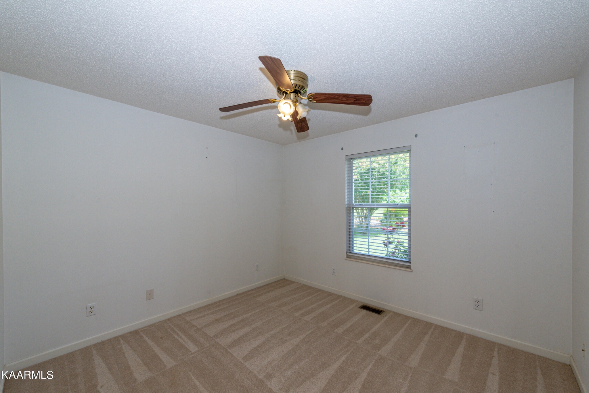 1613 Sevierville Road Maryville, TN 37804 - Photo 32 of 50 an empty room with window and ceiling fan