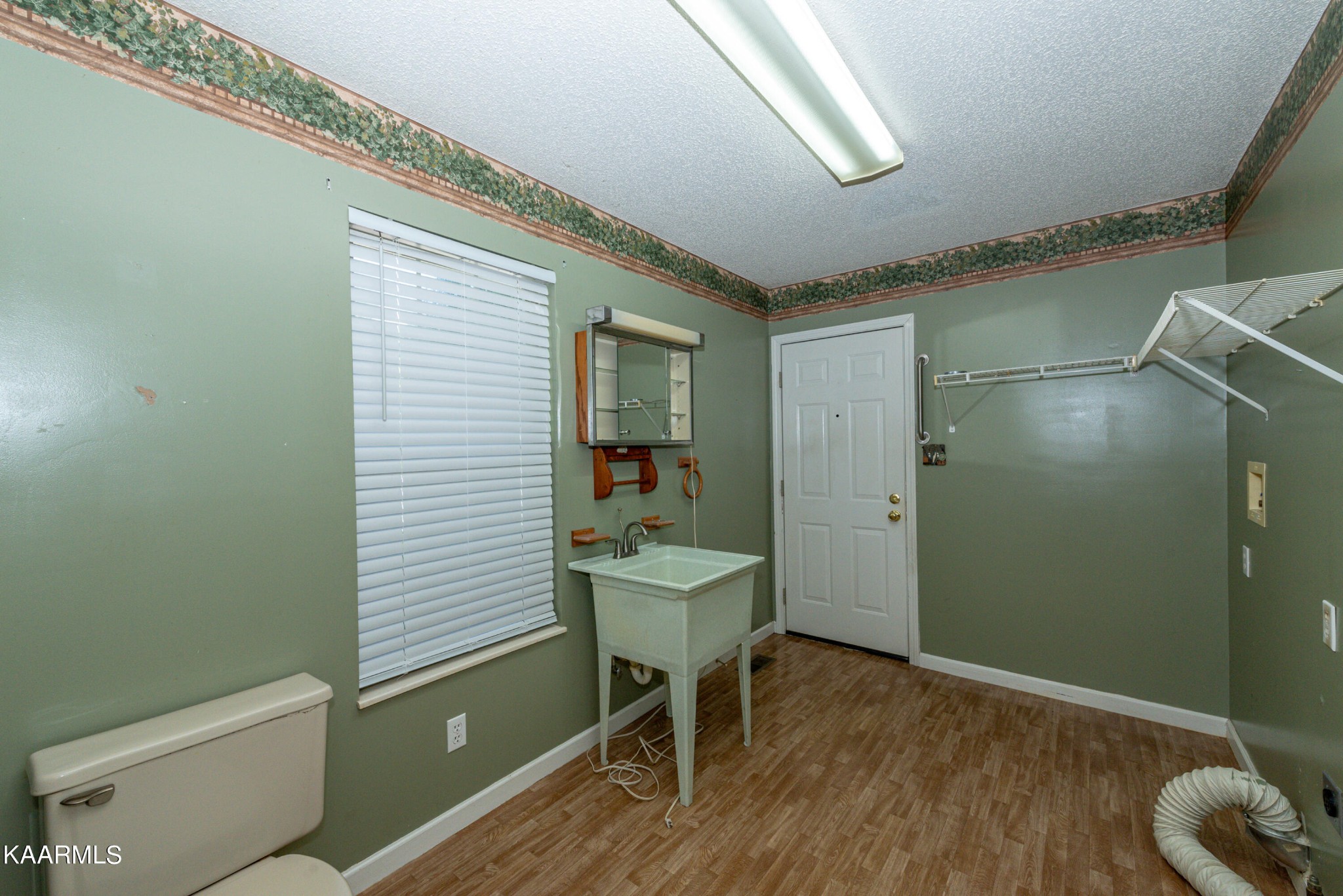 1613 Sevierville Road Maryville, TN 37804 - Photo 39 of 50 a bathroom with a sink a toilet and a mirror