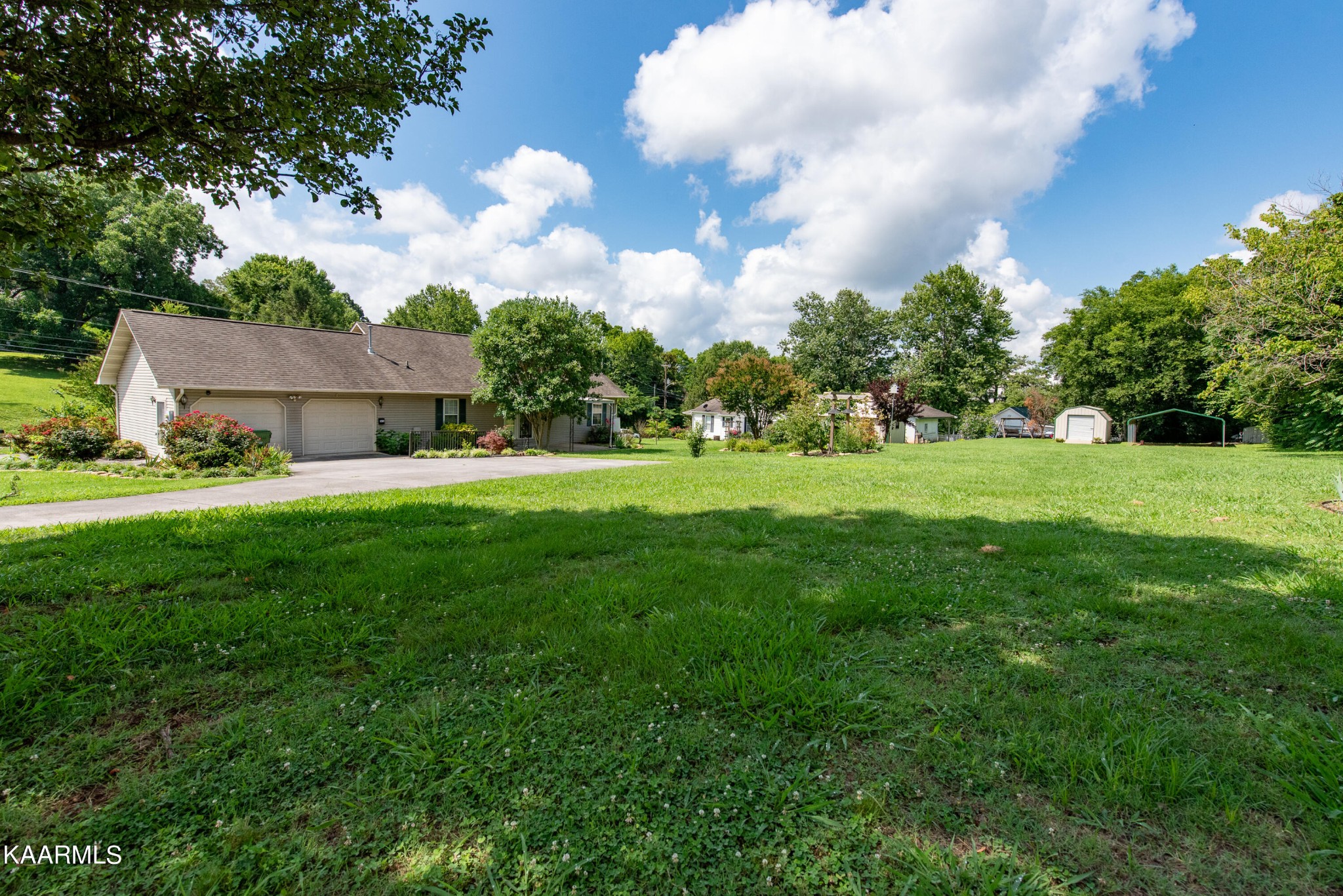 1613 Sevierville Road Maryville, TN 37804 - Photo 6 of 50 a view of a big yard with a fountain and large trees
