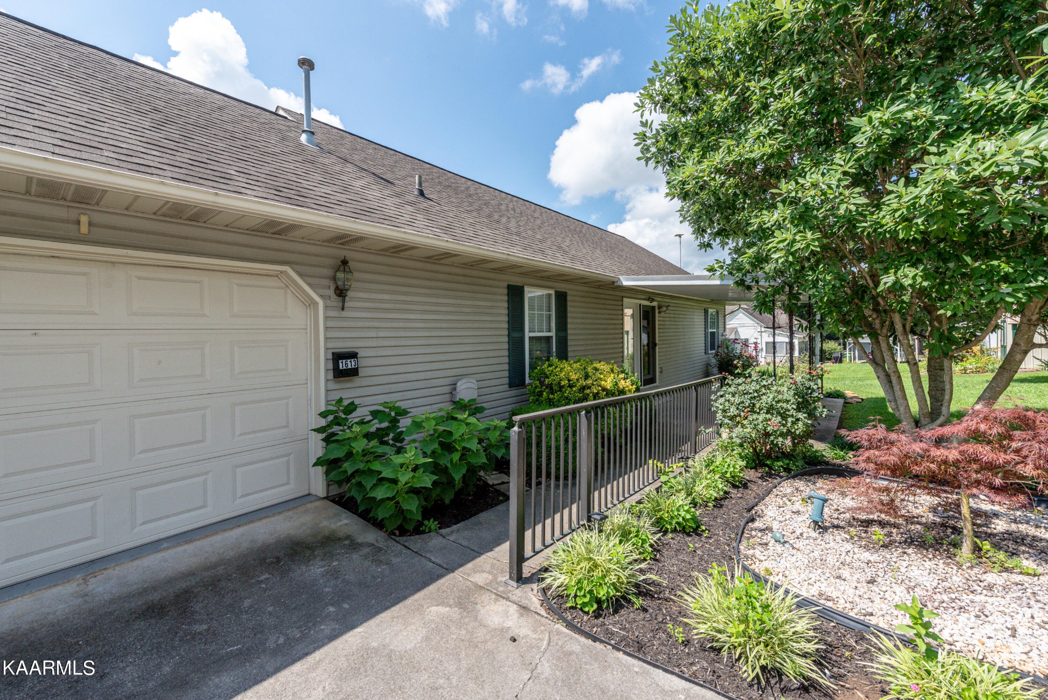1613 Sevierville Road Maryville, TN 37804 - Photo 9 of 50 a front view of a house with a garden