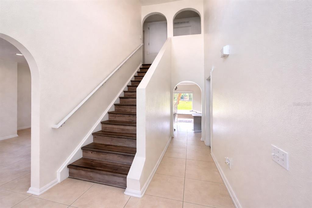 704 Swan Way Kissimmee, FL 34758 - Photo 12 of 15 a view of entryway and hall with wooden floor