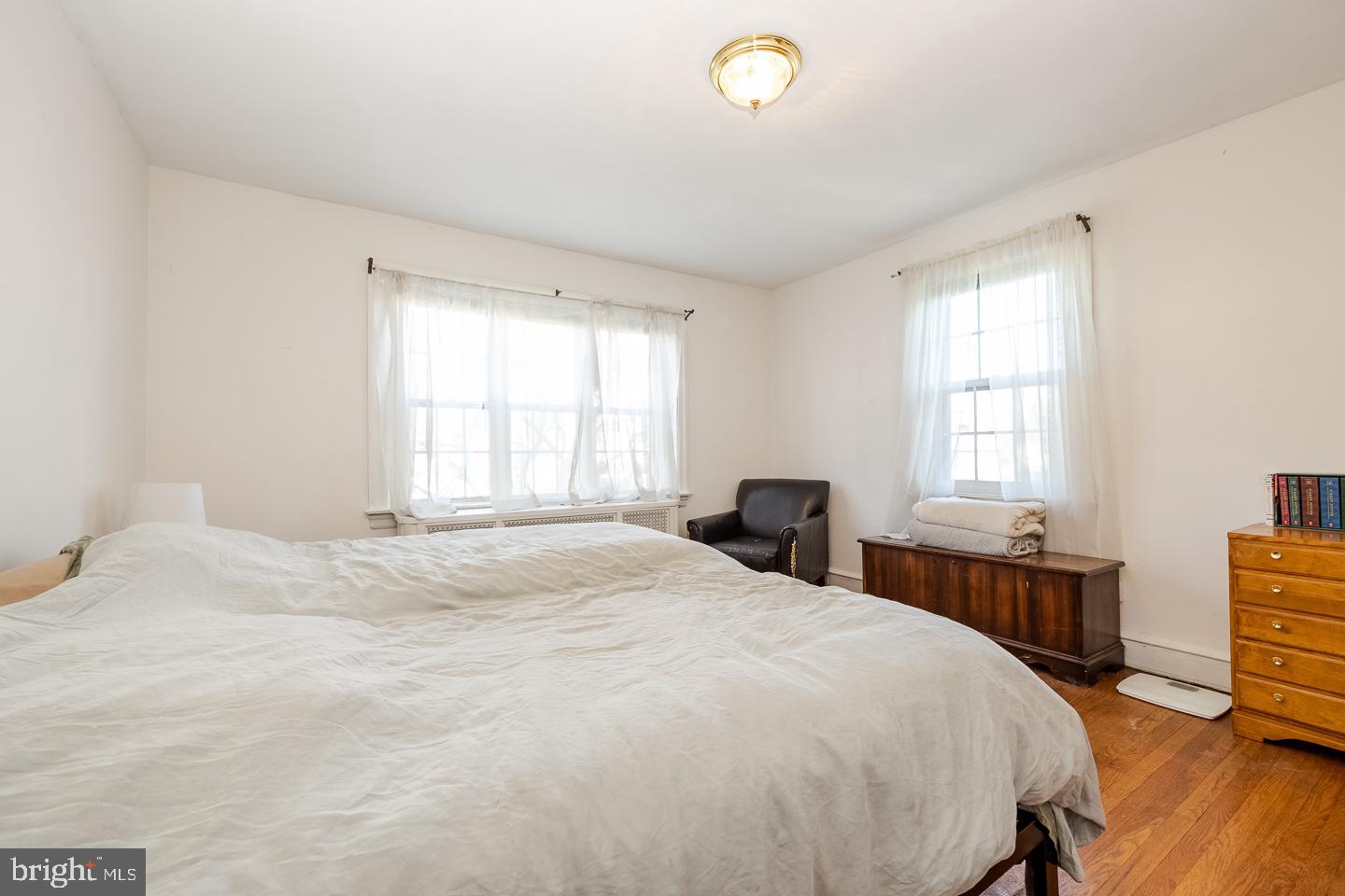 107 Crestview Road Upper Darby, PA 19082 - Photo 12 of 21 a bedroom with a bed and a table